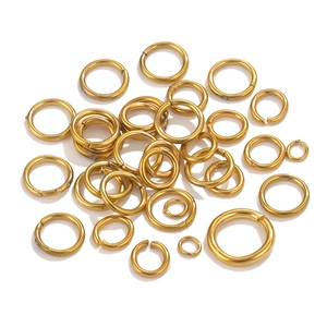Macro view of golden 18K gold plated stainless steel jump rings for DIY jewelry making