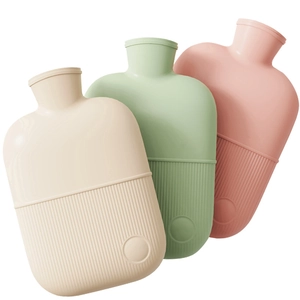 Three reusable hot water bottles in cream, green, and pink colors with non-slip texture
