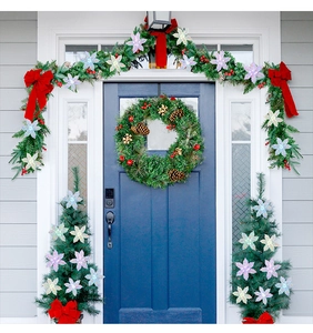 Detailed Christmas door decor set with colorful snowflakes and large red ribbon bows