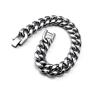 Close-up of a silver stainless steel Cuban link bracelet with a heavy metal design
