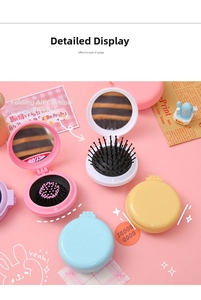 Detail view of colorful macaron folding hairbrushes with mirror and massage cushion