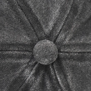 Close-up of charcoal grey washed baseball cap top with stitched seams and fabric button