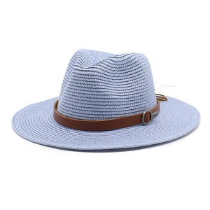 Detail of light blue straw fedora with brown faux leather band and silver metal ring buckle