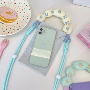 Detail of canvas phone pouch showing macaron color handle and blue braided strap