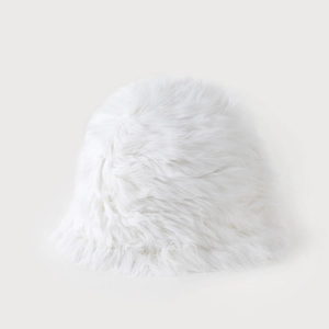 Close-up detail of soft white faux fur texture on a thick winter bucket hat for women