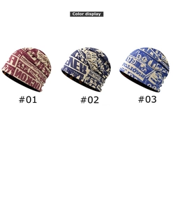 Three color display of thin knit beanies featuring vintage newspaper letter printing