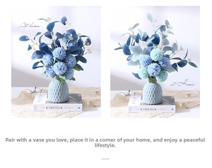 Blue pompon mum artificial flowers in a light blue textured ceramic vase decoration