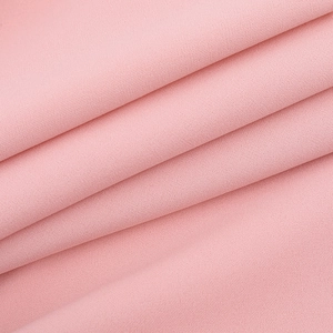 Detailed macro view showing the soft texture and pink fabric layers of the long-sleeved dress