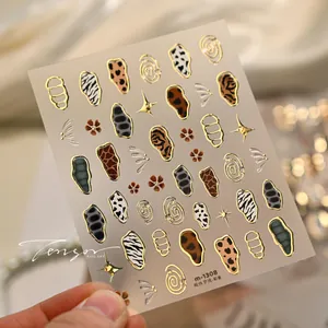 Macro detail of M-1308 nail art stickers with animal patterns and gold foil embossing