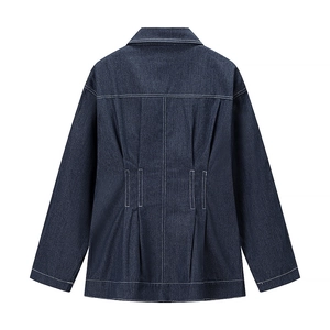 Back view of dark blue denim dress featuring white contrast stitching and waist pleats