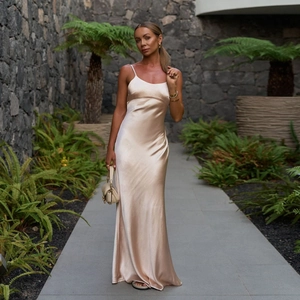 Elegant champagne silk satin maxi dress with thin straps for women in a street style look