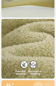 Detail of yellow coral fleece fabric showing high-density weave and soft warm texture