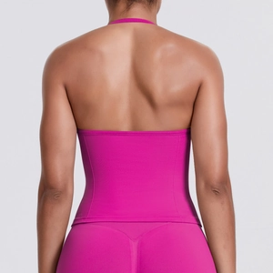 Detail of fuchsia seamless backless sports top and high-waisted yoga set for women