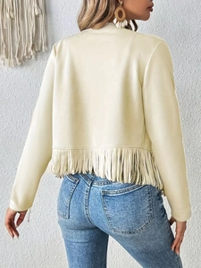 Detail shot of beige suede jacket with long fringes and back stud embellishments