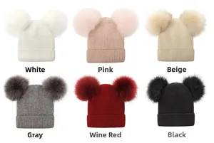 Winter knitted beanie with dual faux fur pom-poms shown in six solid colors detail