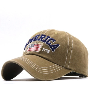 Detail of vintage khaki cotton baseball cap with 3D America embroidery and flag patch
