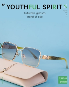 Detail of square gold metal sunglasses with blue gradient lenses and tortoiseshell temples
