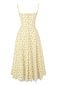 Detailed view of yellow floral summer dress featuring delicate straps and white lace hem