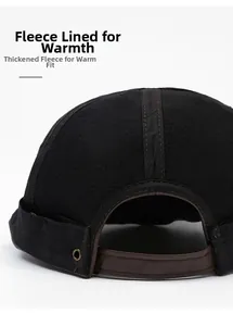 Close-up of the warm fleece lining and adjustable leather strap on a black docker hat