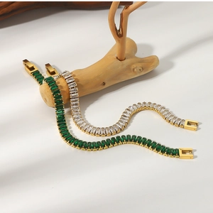 Detail of 18K gold plated tennis bracelets with emerald green and white zircon stones