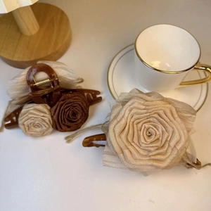 Handmade fabric rose hair claw clips in beige and brown with elegant French style