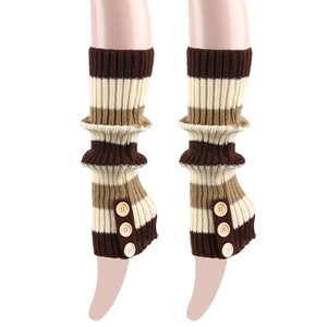 Detail of striped knit leg warmers with side buttons and ribbed cuffs for winter boots