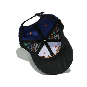 Detail view of the baseball cap's inner structure with graffiti print and adjustable strap