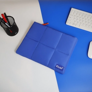 Quilted blue laptop sleeve for 11-13 inch tablets with padded nylon and shoulder strap