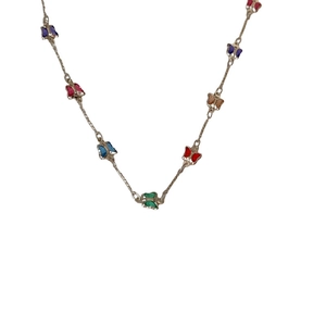 Silver necklace featuring multiple colorful butterfly charms on a thin chain