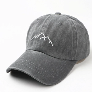 Detail view of washed dark grey baseball cap with white mountain embroidery