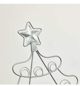 Detailed close-up of the silver star topper on a 50cm wrought iron Christmas tree