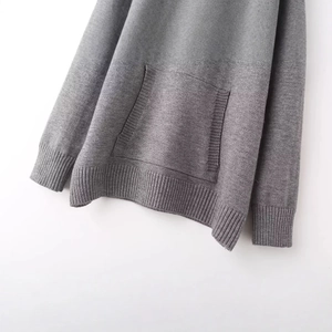 Gray knitted hoodie featuring a spacious front pocket and ribbed hem in a relaxed fit
