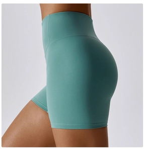 Close-up of high-waisted yoga shorts in lake green showing side view and lifting seams