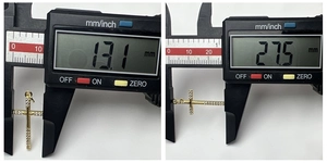 Detailed size measurement of a gold cross pendant with cubic zirconia stones