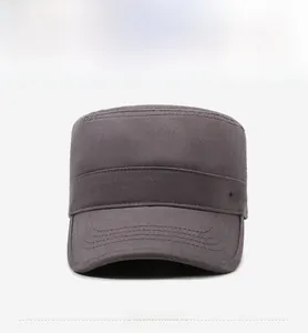 Close-up of side metal plate and stitching on dark grey cotton flat top military cap