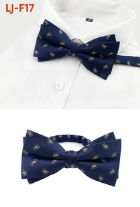 Detailed view of navy blue paisley bowtie with adjustable neck strap and silk texture
