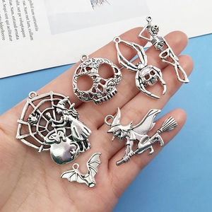 Silver metal Halloween charms featuring spider web witch skull spider and bat pendants