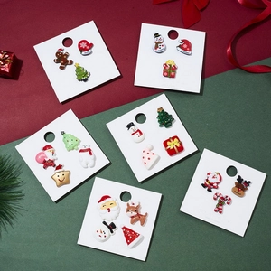 Christmas acrylic earring set with Santa Claus and Reindeer icons on white card