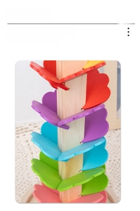 Detailed macro view of colorful wooden petals and polished leaves on the music tree toy