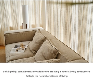 Close-up detail of textured linen fabric sofa cover with visible weave and neat stitching