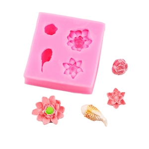 Detail of pink silicone mold featuring lotus flower and fish shapes for DIY resin crafts