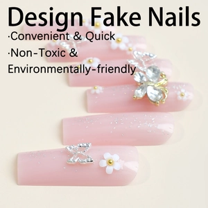 Pink press-on nails featuring 3D silver butterflies, white flowers and glitter accents