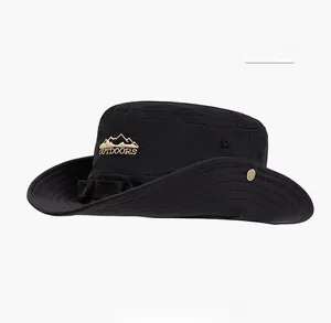 Detail of black cotton outdoor hat featuring embroidered mountain and wide stitched brim