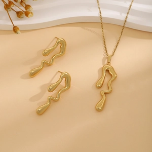 Exquisite gold necklace and earrings set with abstract melted geometric floral texture