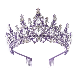 Detailed view of a purple crystal crown with metal alloy and shimmering rhinestones
