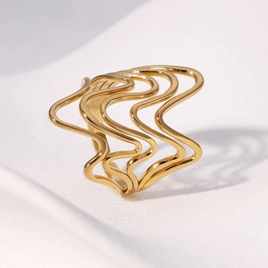 Minimalist gold multi-layer wavy geometric stainless steel open ring on a cream background