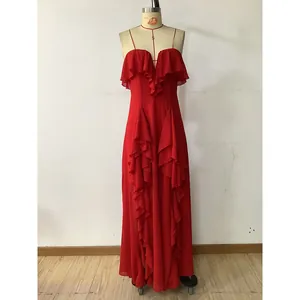 Detail of red evening dress showing ruffled V-neckline and layered chiffon fabric