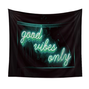 Detailed view of the Bohemian black tapestry with neon style good vibes only quote