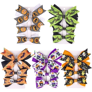 Five-piece Halloween bow hair clips set with pumpkin and ghost motifs on cards