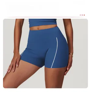 Detail of high-waisted yoga shorts in navy blue with white side stripe accents